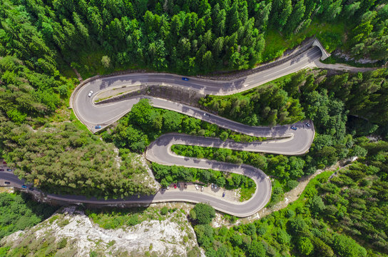 curved road with cars and beautiful forest landscape. Bicaz gorges, Romania. Aerial view from drone