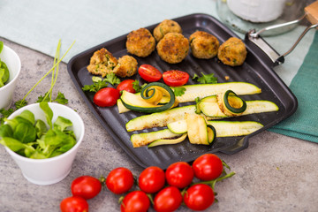 Zucchini and meatloaf on the grill pan