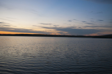 Fototapeta na wymiar Evening sky over the lake