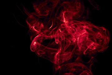 Red smoke on black background