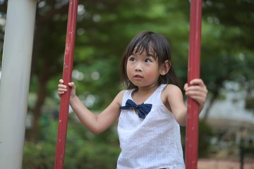 Portrait Asian little girl Playing the playground	