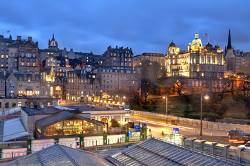 Cityscape in old town district of Edinburgh City being lit up at night in central Edinburgh,...