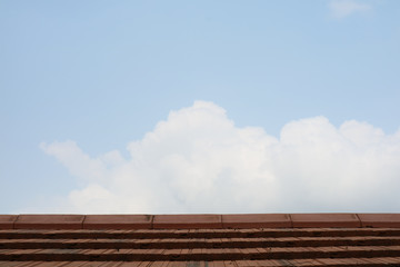 top roof and heap white cloud and fresh blue sky