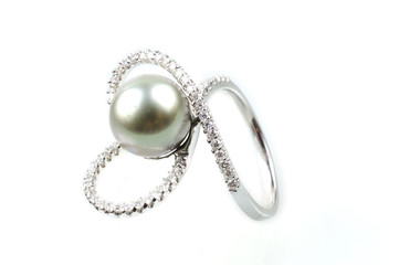 Pearl ring on white background