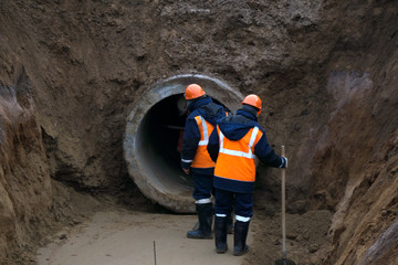 Repair of city water supply. Replacement of old rusty metal pipes on plastic pipes. New modern technologies of urban engineering networks. City Water Pipeline .