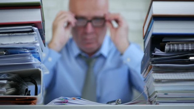 Blurred Image of Businessman Starting Working in Office With Financial Documents