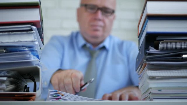 Businessman Blurred Image in Office Fill Documents and Take Out Eyeglasses Tired