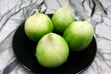 fresh green radish on white background eating flavor .