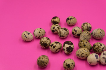 Fototapeta premium Textured spring background with small quail eggs. Eco products. Horizontal format .