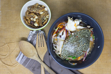 Spicy salad with raw blue crab