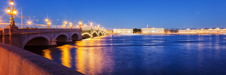 Fototapeta na wymiar Beautiful night cityscape, night view of St. Petererburga and illuminated bridges, traveling in Russia, panorama banner format