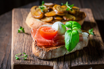 Tasty and homemade various bruschetta with fresh ingredients