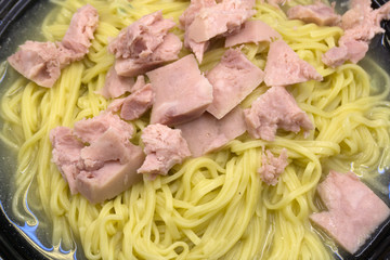 Homemade pasta bake with ham and cheese .