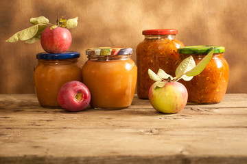 Obraz na płótnie Canvas canned food in glass still life with apple