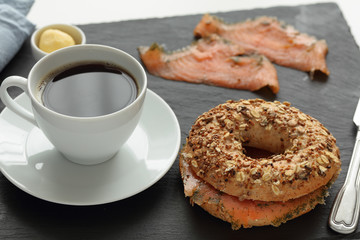 Salmon bagel sandwich and coffee