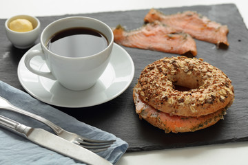 Salmon bagel sandwich and coffee