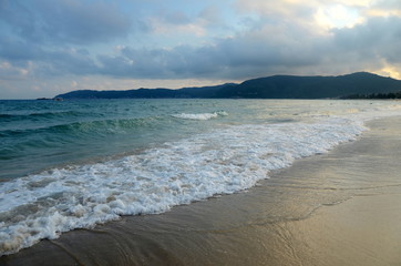 Fototapeta na wymiar Surf on Yalong bay, Hainan Island, China, may 2011