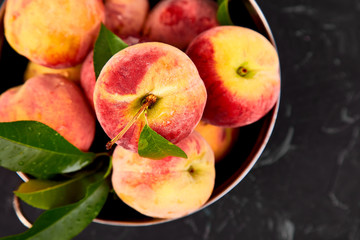 Ripe peaches in a bowl