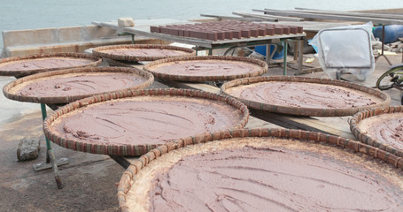 Naklejka premium Shrimp paste being dried under the sun in Tai O of Hong Kong