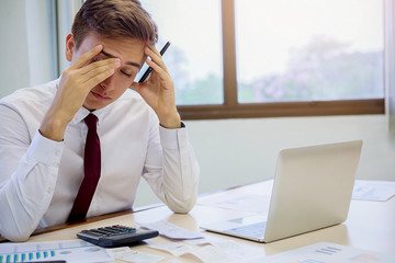 an with bills and calculator. Woman using calculator to calculate bills at the table in office....
