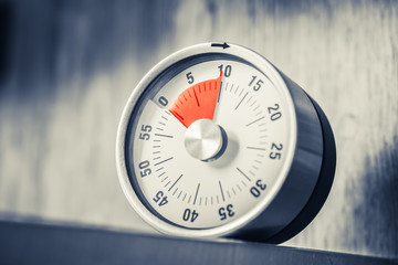 10 Minutes - Analog Kitchen Timer With Red Mark Placed In A Shelf In Monochrome Colors