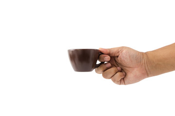 Hand of man is holding the brown ceramic coffee cup.
