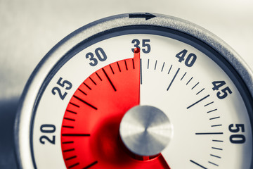 35 Minutes - Analog Kitchen Timer With Red Mark Placed On A Fridge In Monochrome Colors