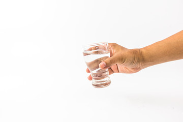 hand of man is holding the transparent glass with pure water