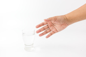 hand of man is holding the transparent glass with pure water