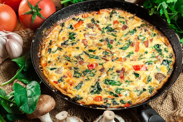 Frittata made of eggs, mushrooms and spinach