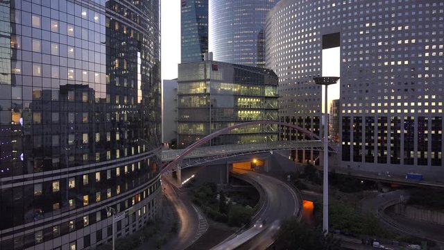 Evening timelapse business buildings and street cars traffic