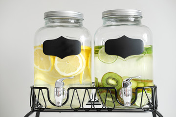 Fresh citrus lemonade with lemons and limes in beverage dispenser