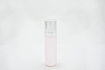 white triangular hygienic tube of cream, on white background