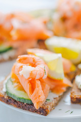 Salmon sandwiches served on plate