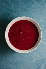 Red fruity smoothie in bowl