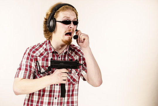 Gamer man shooting from gun