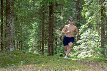 The athlete commits a morning run through the forest