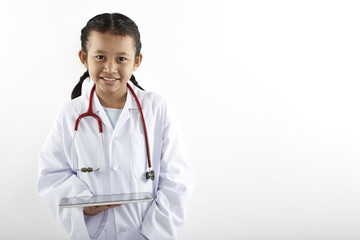 Cute Asian little girl in doctor costume