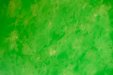 background of Venetian plaster of green color