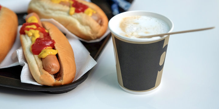 The-dogs, sauce, ketchup, coffee with milk in a Cup. Latte