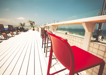 Vacant seats at the open-air bar on the roof