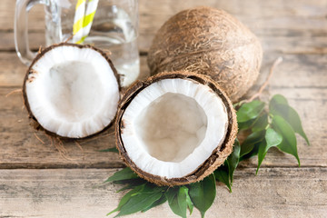 Fototapeta na wymiar Coconuts and Glass Jar with Coconut Water Old Wooden Background Straw Horizontal