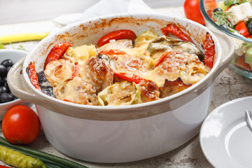 Traditional tasty rustic stew of chicken and vegetables  with Greek salad and black olives