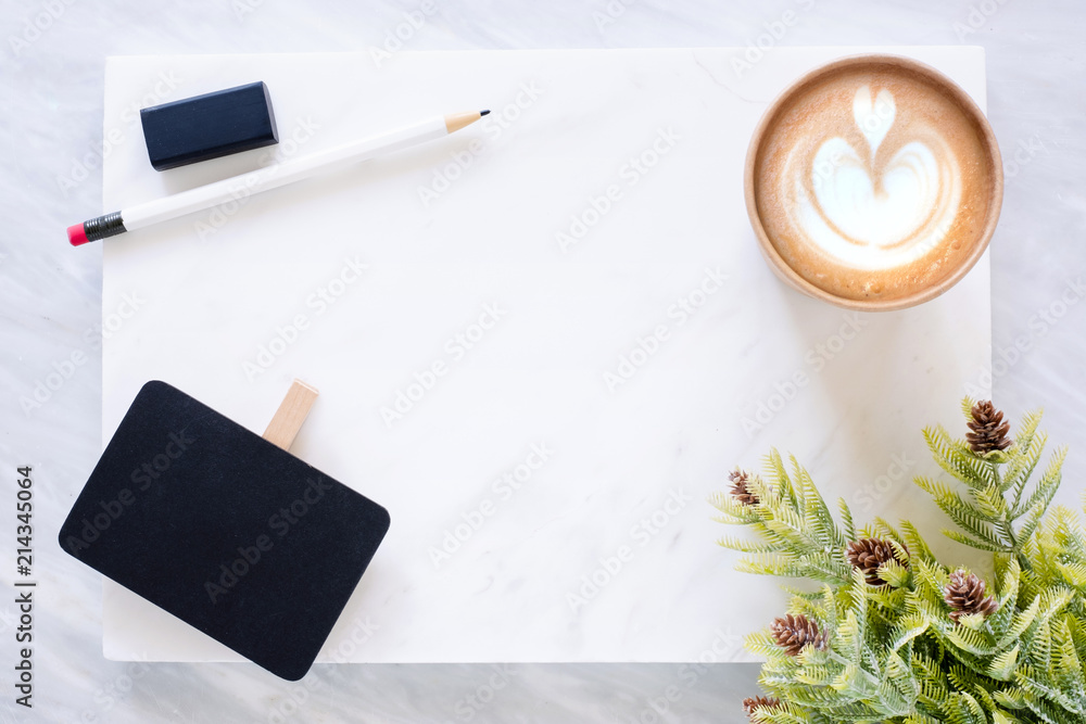 Poster Top view of Clip blackboard, pencil, eraser pine leaf and coffee cup on white marble block and stack on grey marble table.Flat lay Mock up template for adding or display text or design