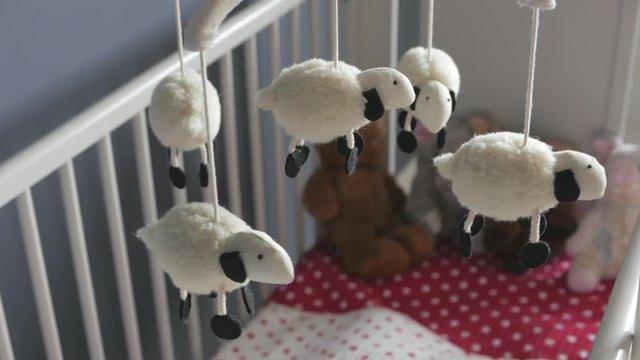 Sheep Mobile spinning above baby crib