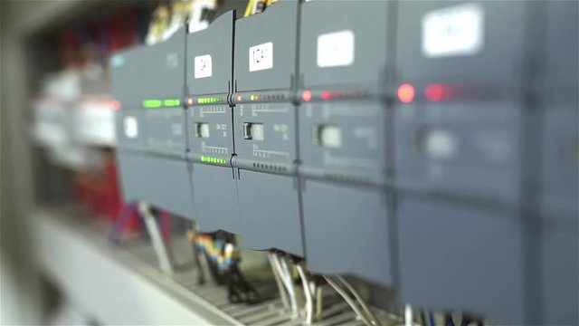 The electrician switches on the circuit breakers and starts the system