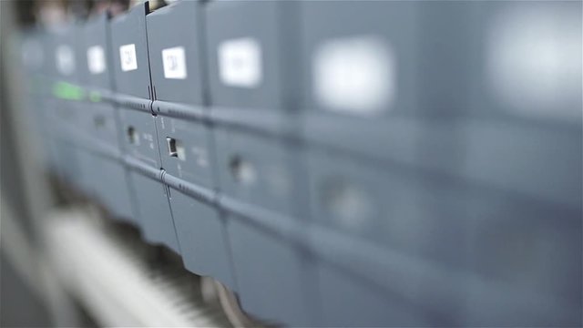 The electrician switches on the circuit breakers and starts the system
