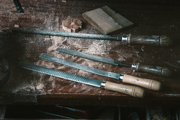 Cabinetmaker tools / rasps of joinery on the work table of the workshop