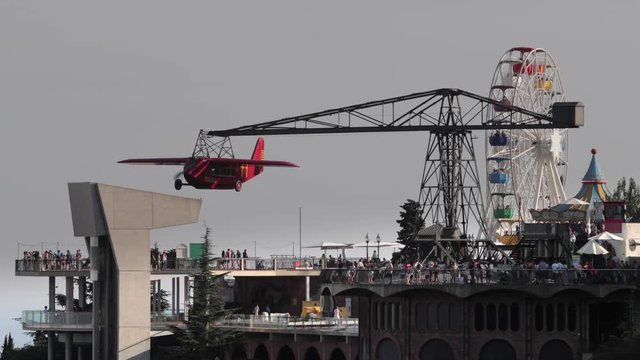 close up video of the rides in the tibidabo amusement park overlooking the city of barcelona