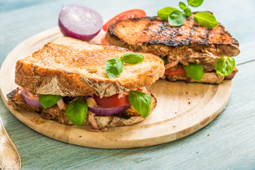 Healthy delicious homemade sandwiches with vegetables, ham and cheese